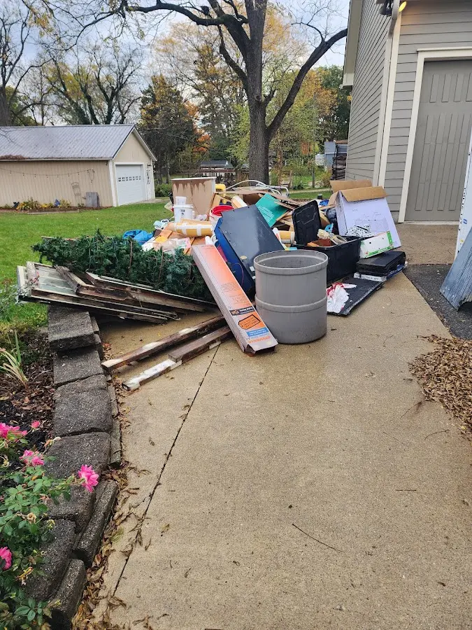 Dumpster being loaded with debris for Roofing Dumpster Rental in Montgomery